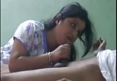 A girl with loose hair, twist the roll cake near porno muvies the table